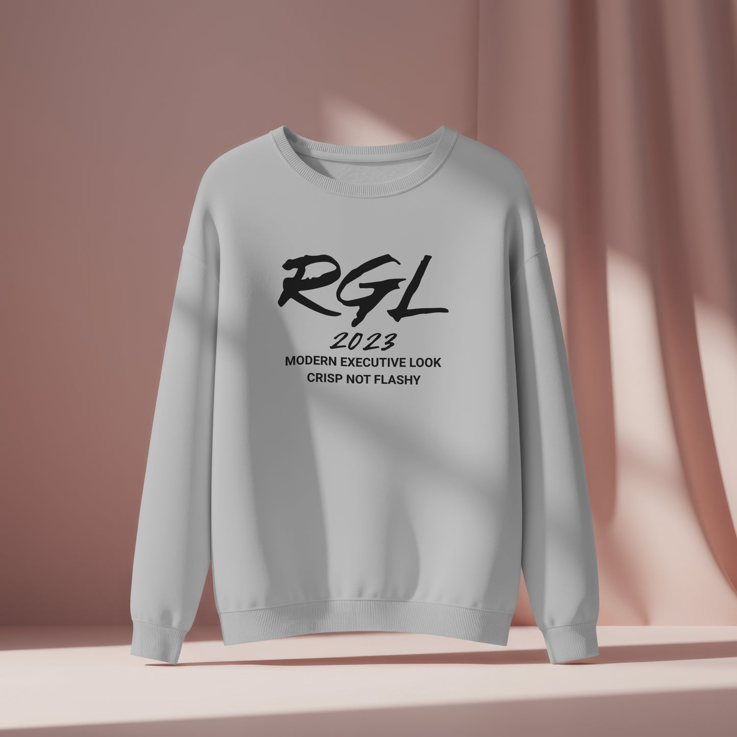 Gray sweatshirt with black text on a pink background